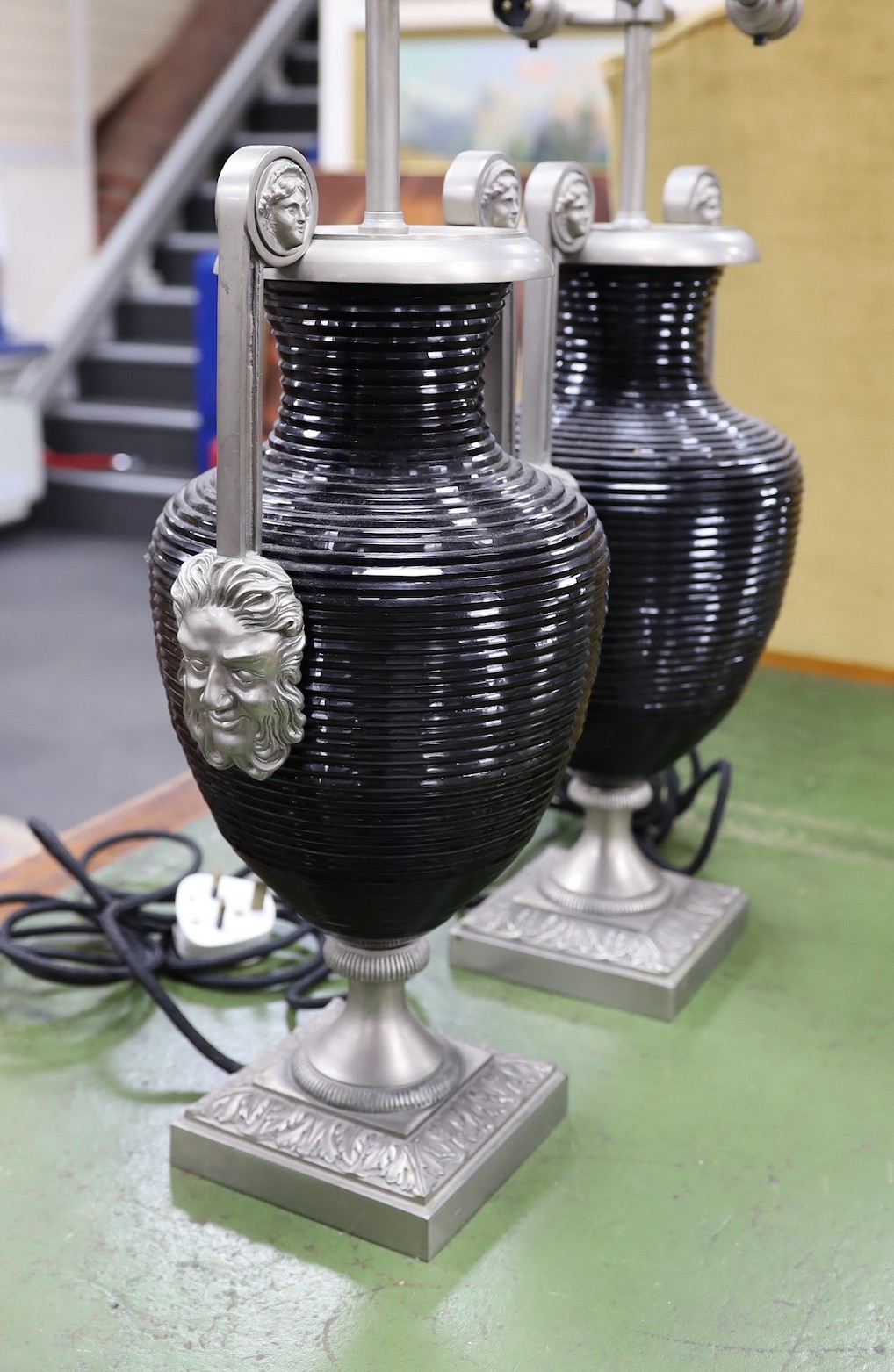 A pair of classical style ribbed glass and metal table lamps, 65cms high
